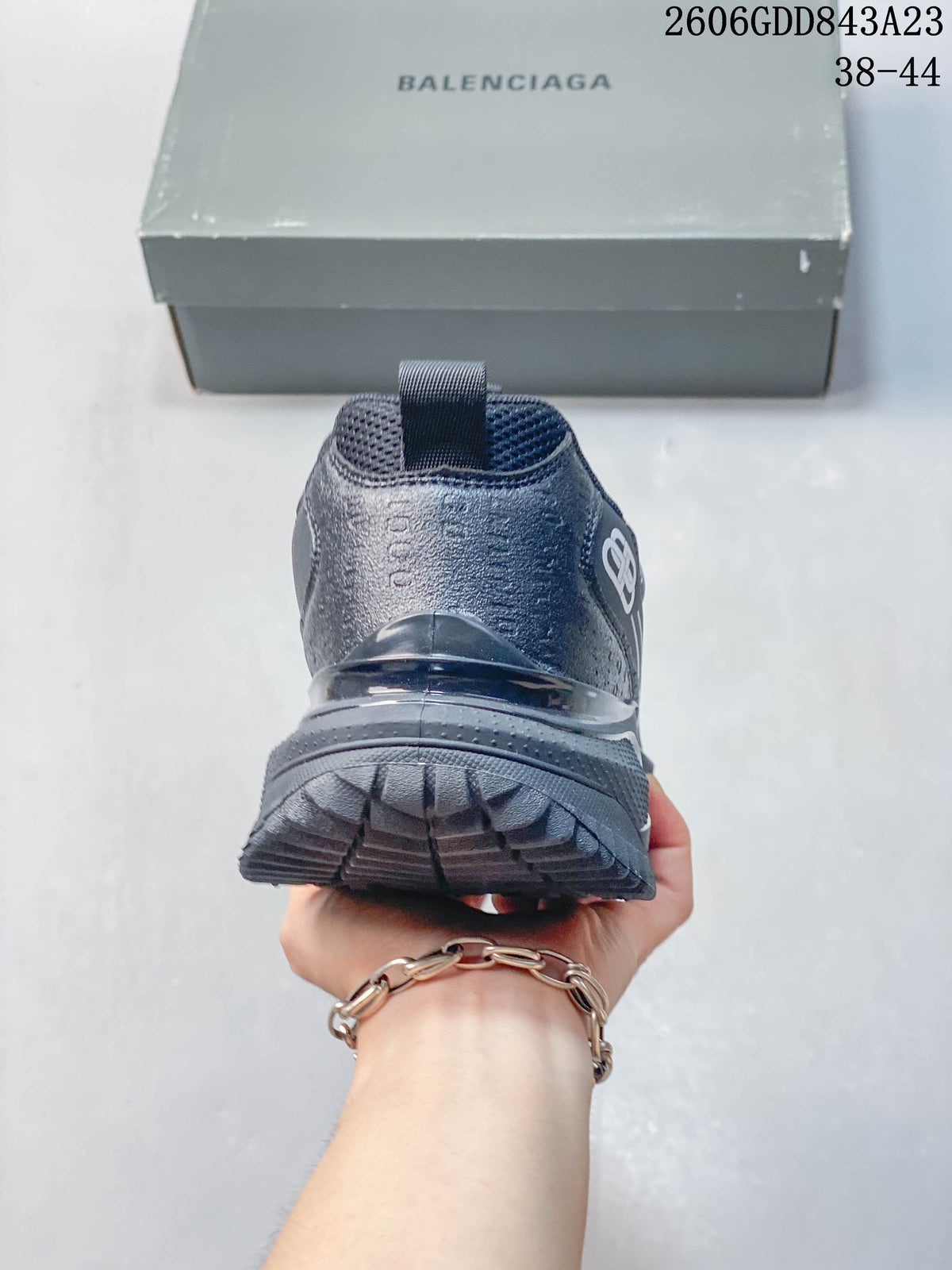 Rear view of the grey sneaker showing the heel and chunky sole.