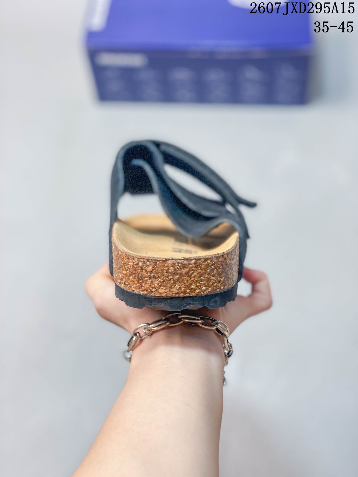 Rear view showing the open heel, cork-look footbed sidewall and dark outsole.