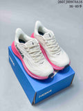 Pair of white and bright pink HOKA Clifton 10 sneakers displayed on a blue shoebox; image text shows style code 2607JHD976A16 and size range 36–40.5.