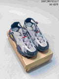 Pair of silver and black Mizuno sneakers displayed on a shoebox; model code 2607JWD797A17 and size range 36–45 are visible.