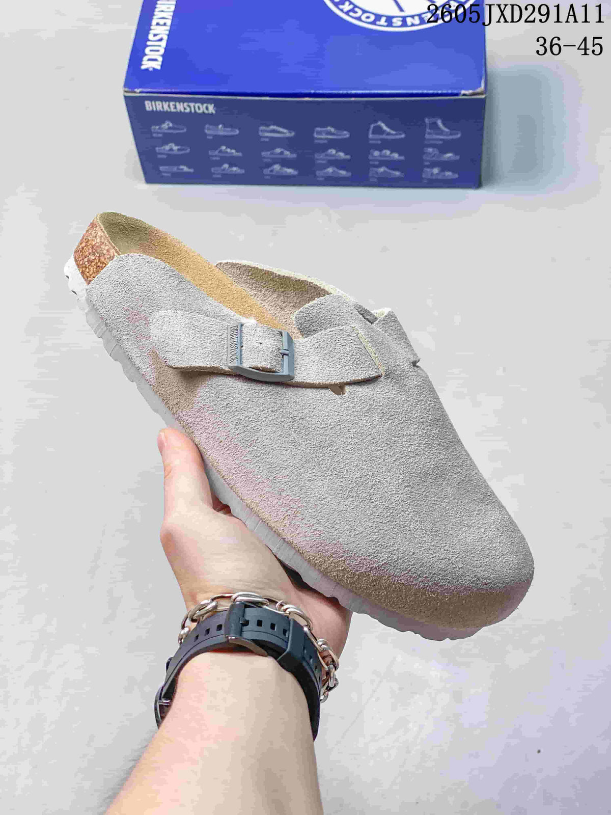 Light gray suede-like closed-toe sandal with an adjustable buckle, shown beside a Birkenstock-branded box.
