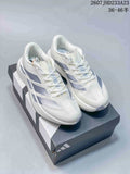 Pair of white Adidas Adizero Evo SL sneakers with light blue-gray side details displayed on an Adidas shoebox.