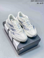 Pair of white Adidas Adizero Evo SL sneakers with light blue-gray side details displayed on an Adidas shoebox.