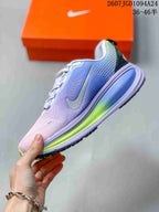 Side profile of the lavender and blue sneaker showing the Nike Swoosh and lime midsole accent.