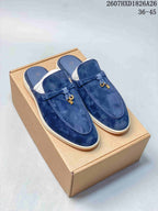 Pair of navy suede-look loafer mules displayed on a plain cardboard box, with style code 2607HXD1826A26 and size range 36–45 visible above.