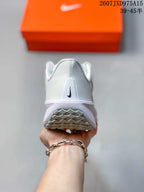 Rear view showing the white heel, black Nike branding, and outsole pattern.