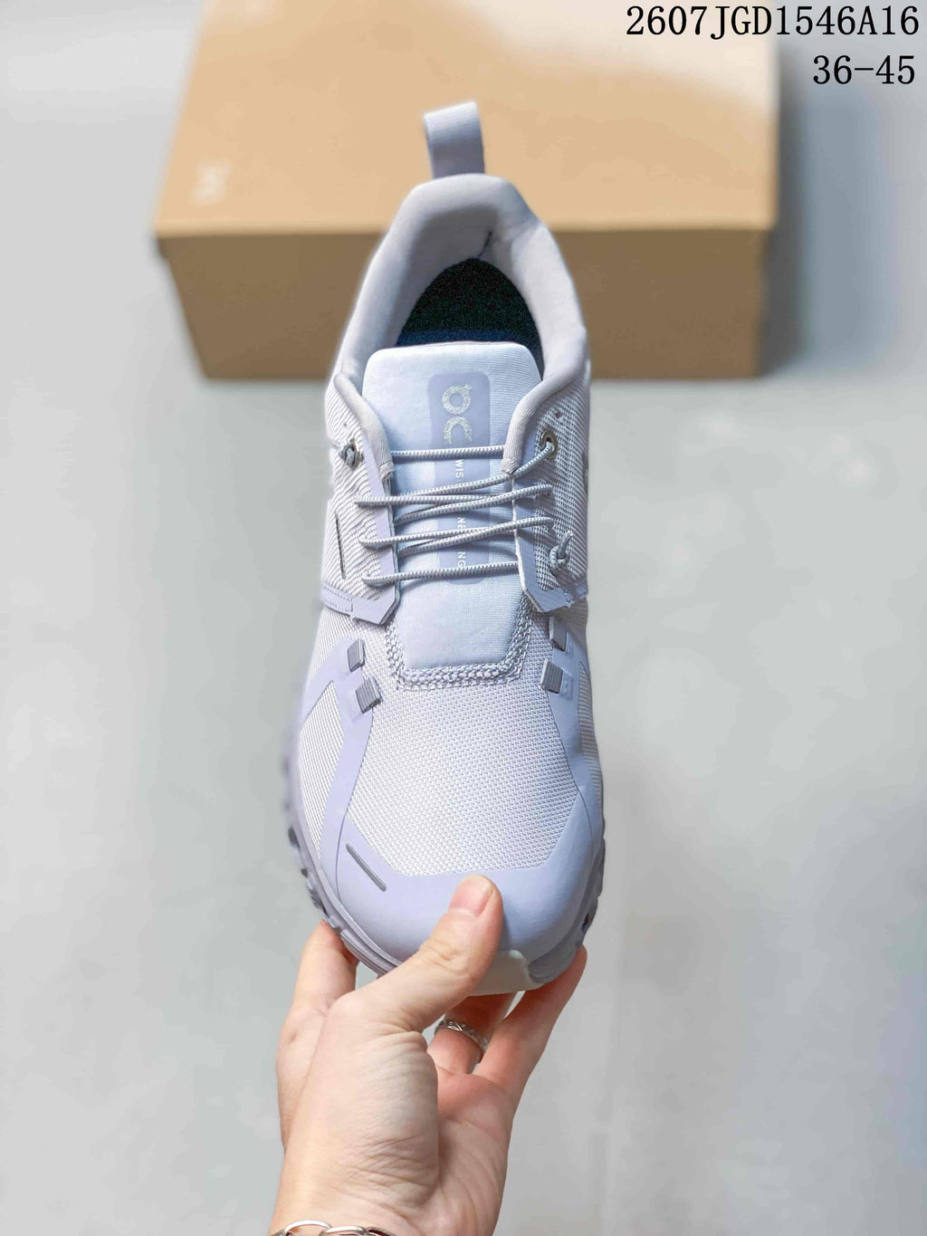 Top view of the sneaker showing the tongue, laces, textured toe box and light gray panels.