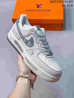 Close-up of a light gray low-top sneaker with contrast overlays
