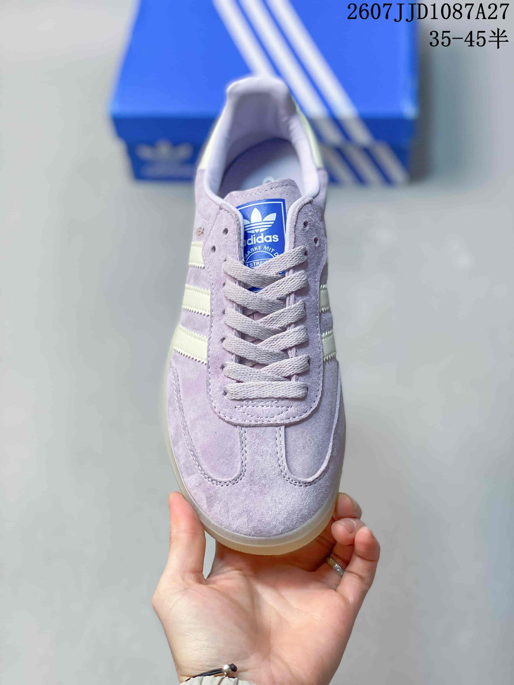 Top view showing the lace-up vamp, padded collar, and blue adidas tongue label.