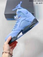 Side profile showing the light blue layered upper, side mesh panel, lace-up construction, dark midsole and visible cushioning window.
