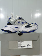 Side profile of the sneaker resting on its box; the box label shows Cargo, style code 785756 W2MV1 1940, White/Blue, and sample size C 37.