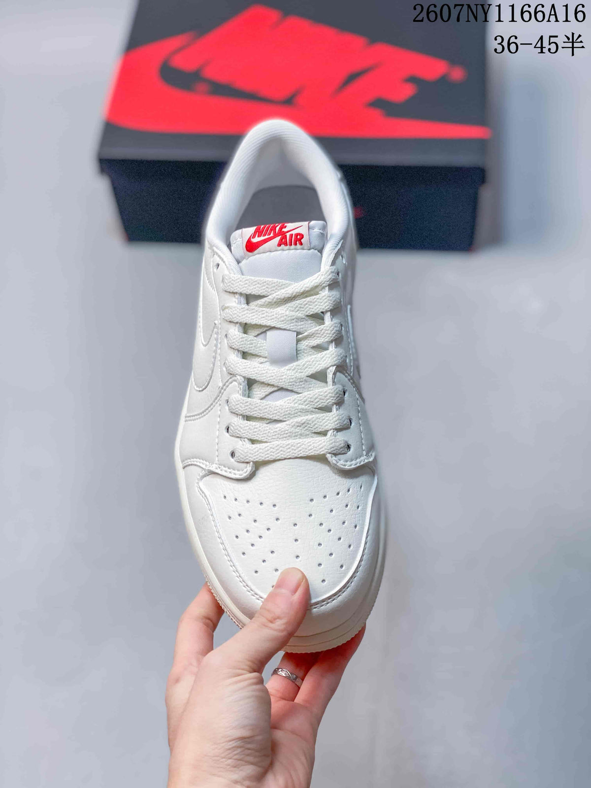 Top view of a white sneaker showing the perforated toe box, white laces, tongue, and red Nike Air label.