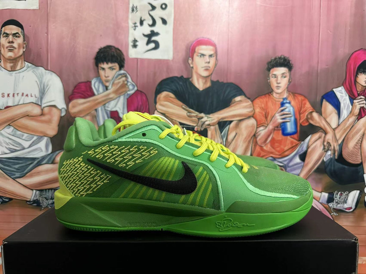 Side view showing the black Swoosh, patterned green panels, and sculpted sole.