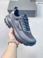 Angled side view of a dark gray ECCO sneaker showing the branded side detail, mesh-textured upper, lace-up closure, and lugged outsole.
