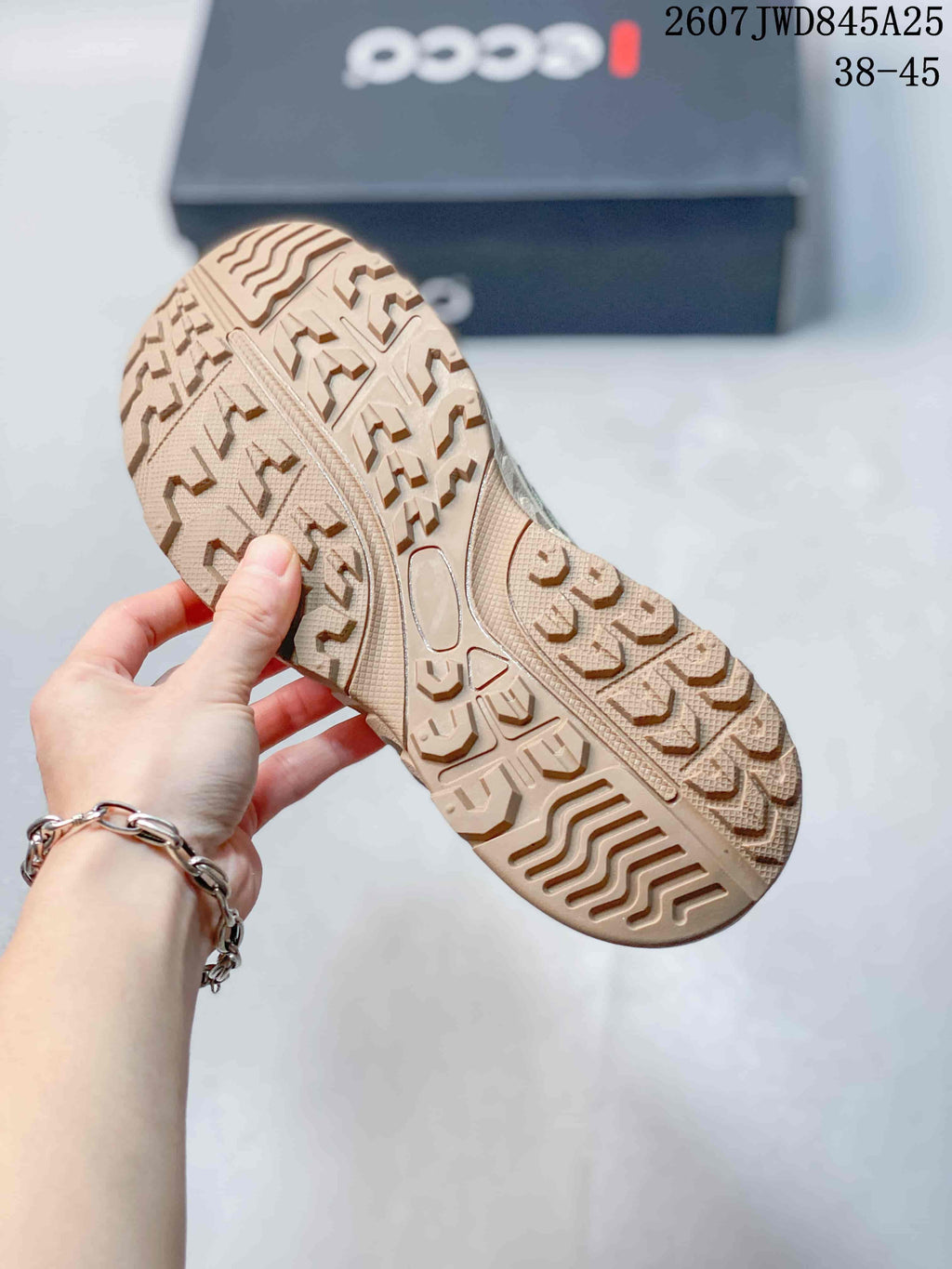 Close-up of the textured rubber outsole showing a multi-directional tread pattern.