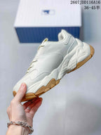 Side view of the off-white low-top sneaker showing layered panels, stitching and a chunky sculpted sole.