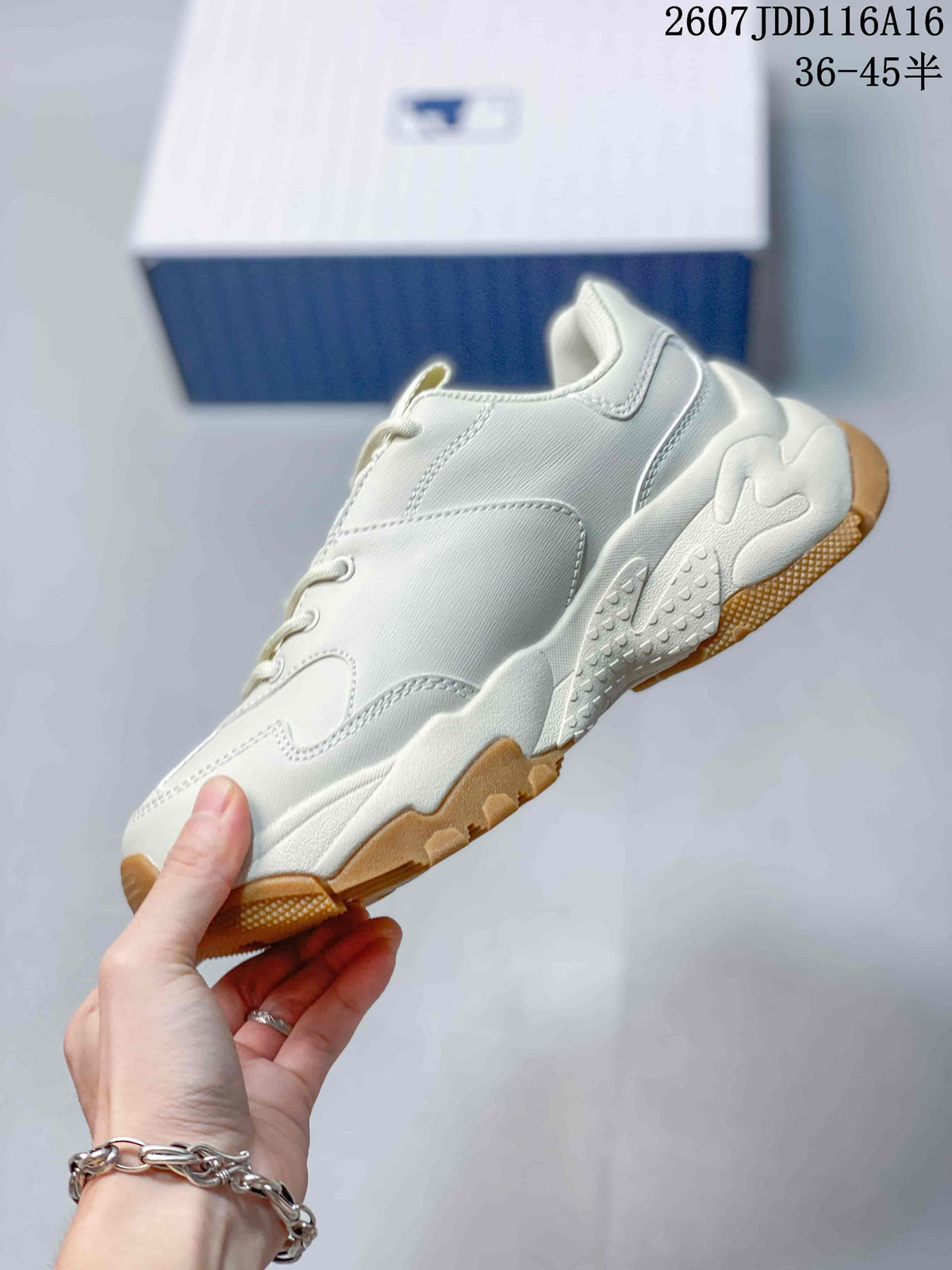 Side view of the off-white low-top sneaker showing layered panels, stitching and a chunky sculpted sole.