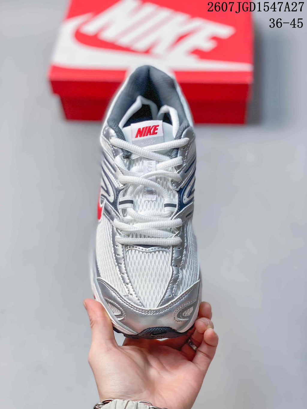 Top view of a Nike Air Max Moto 2K sneaker showing the mesh toe box, laces, tongue, and padded collar.