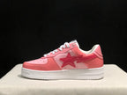 Clean side profile showing the pink and white low-top silhouette and star-shaped side graphic.