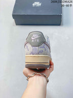 Rear view of a patterned lavender and grey Nike Air Force 1 sneaker