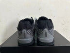 Rear view of black and grey low-top Nike Kobe basketball shoes