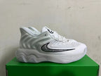 Side view of a white and grey Nike sneaker with a black-outlined side logo