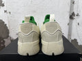 Rear view of cream and green Dame 9 basketball shoes