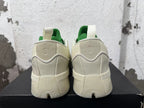 Rear view of cream and green Dame 9 basketball shoes