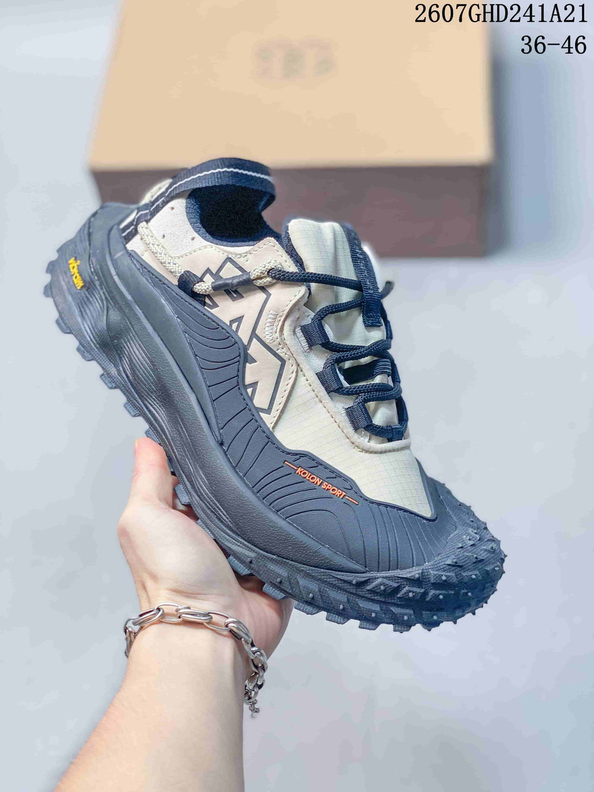 KOLON SPORT LIT CAMP sneaker in a light upper with dark navy overlays and a rugged dark outsole.