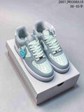 Pair of pale blue and white Nike Air Force 1 '07 style low-top sneakers displayed on a shoebox.