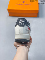 Rear view of a low-top sneaker with cream heel panel and dark heel tab