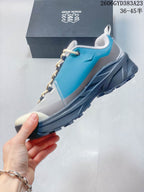 Side profile of a gray and teal low-top outdoor shoe