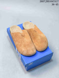 Pair of tan adidas Originals Adimule closed-toe slip-on mules displayed on a blue shoebox; the image also shows style code JQ4367 and the range 36–45.