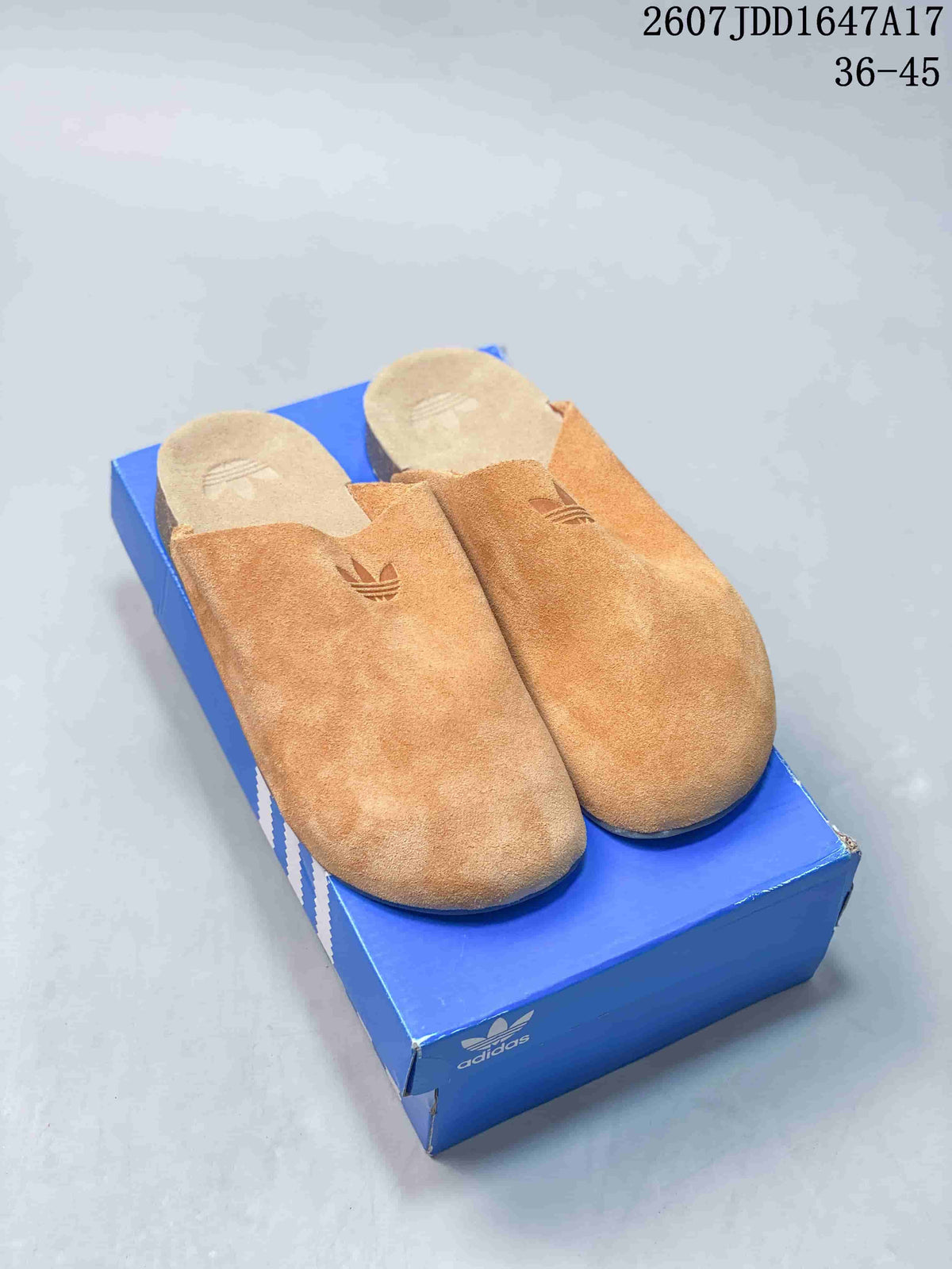 Pair of tan adidas Originals Adimule closed-toe slip-on mules displayed on a blue shoebox; the image also shows style code JQ4367 and the range 36–45.