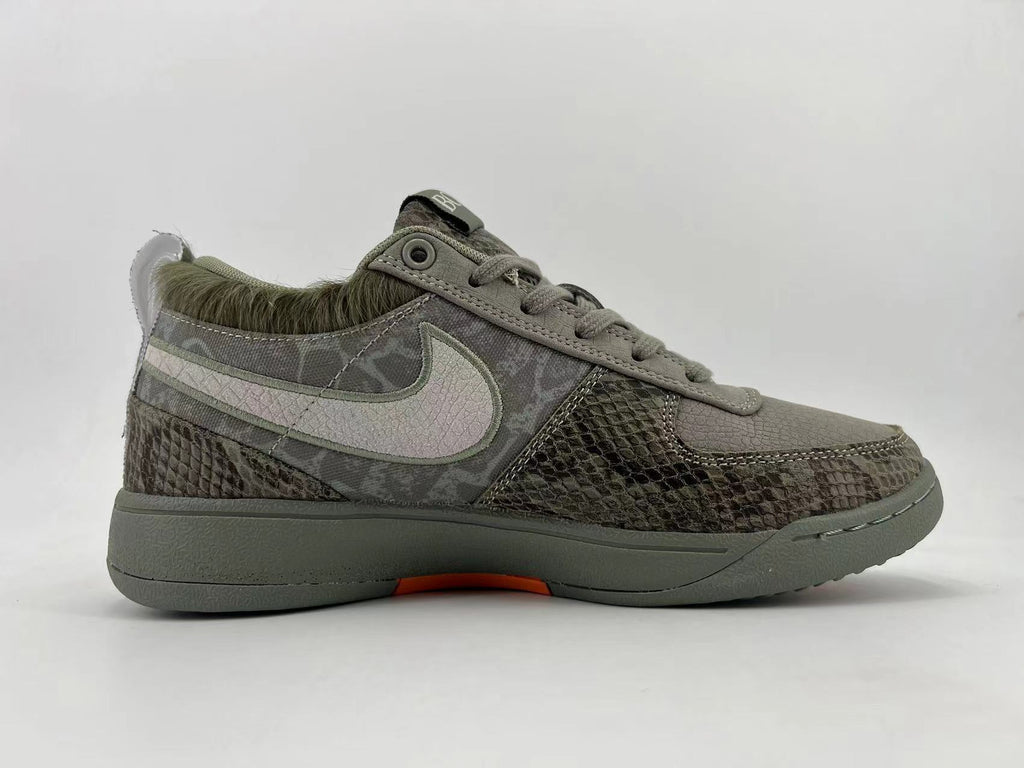 Side profile showing the patterned upper, light Swoosh, and fuzzy heel trim