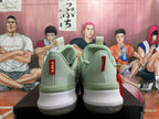 Rear view of jade green and white Nike sneakers with heel pull tabs, red vertical branding details, and textured outsoles.