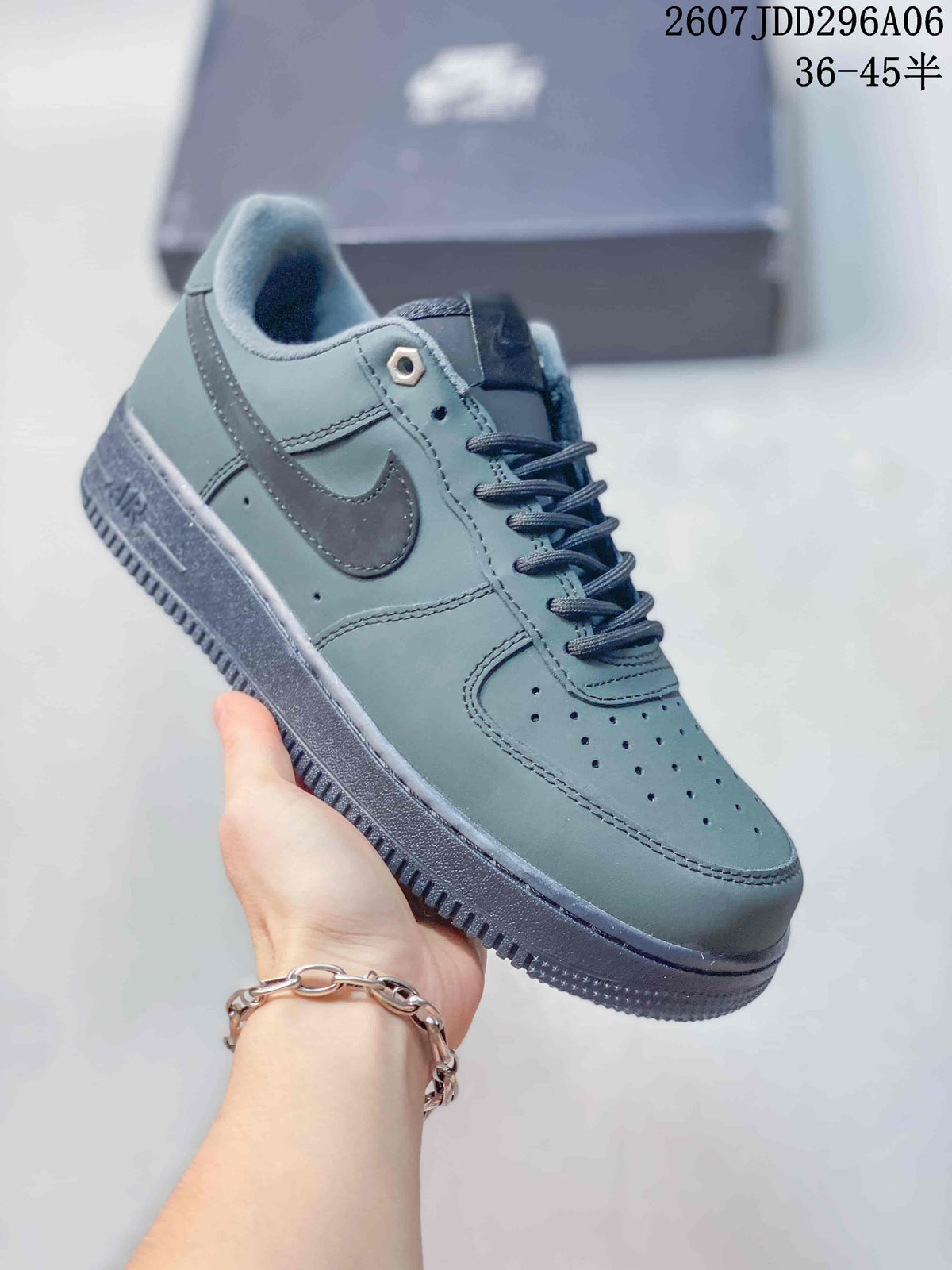 Angled side view highlighting the low-top silhouette, tonal Swoosh and textured rubber outsole.