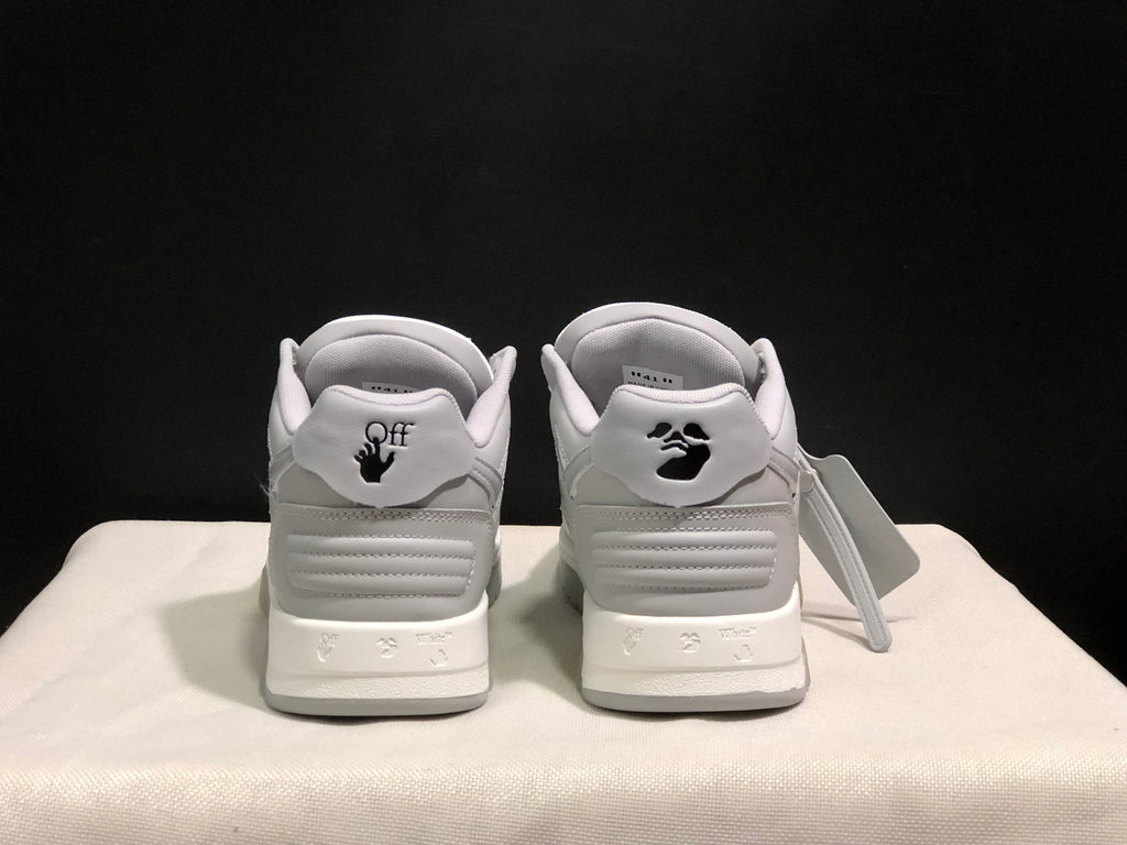 Rear view showing heel branding details, padded heel panels, and segmented soles.