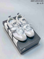 White and silver adidas JOG 2.0 sneakers with ribbon laces