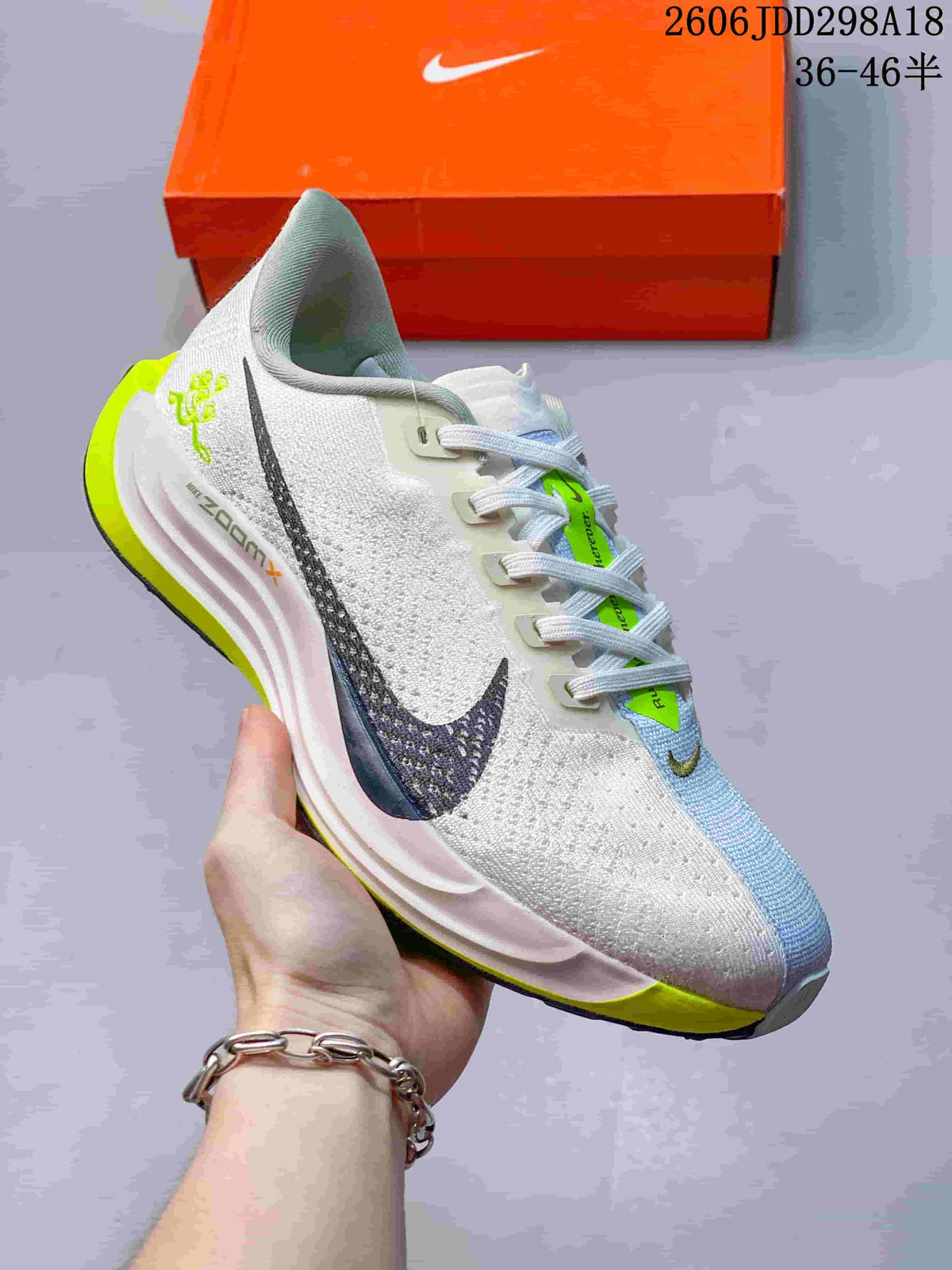Angled side view showing the textured white upper, dark swoosh, pale blue forefoot panel, and lime heel and outsole accents.