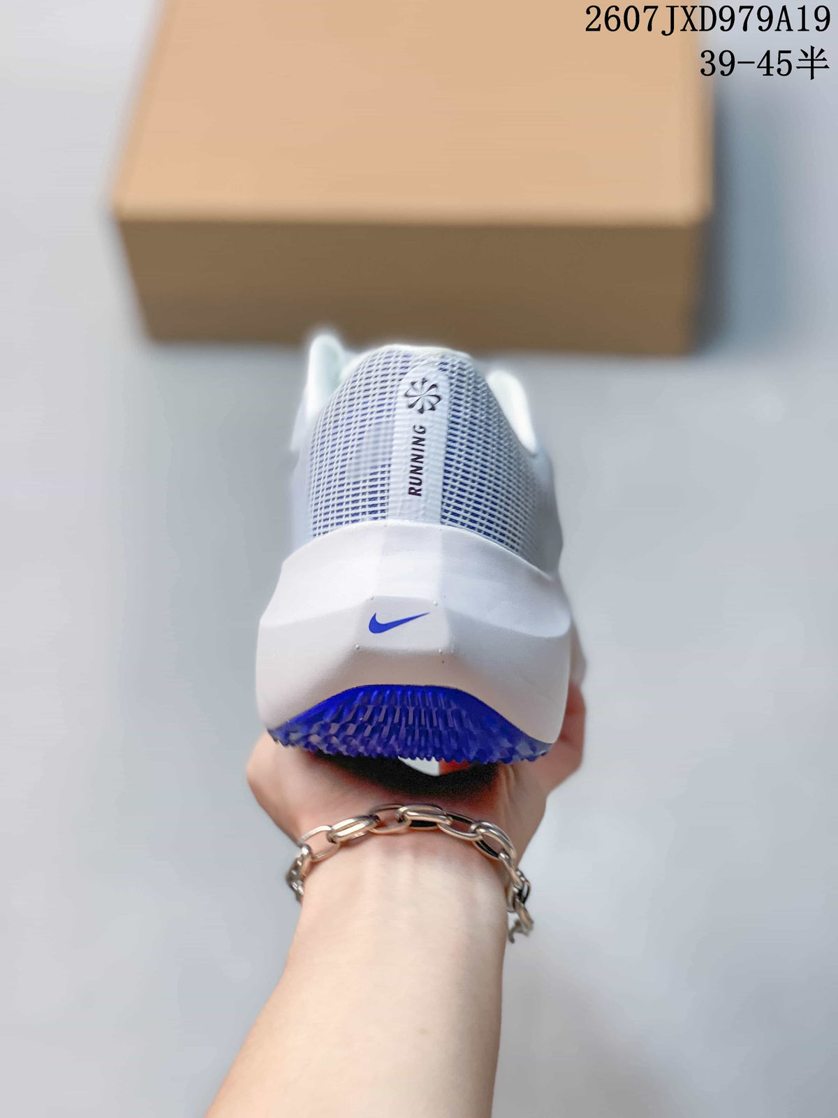 Rear view of a white Nike running sneaker with a blue logo and blue outsole detail.