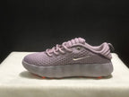 Side profile showing the perforated upper, metallic Swoosh and thick sculpted sole.