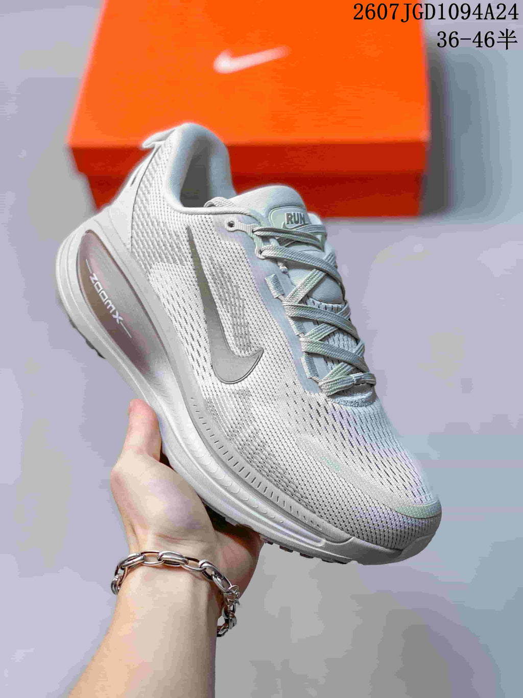 Angled side view of the sneaker showing the patterned upper, Nike side mark, and ZoomX branding on the midsole.