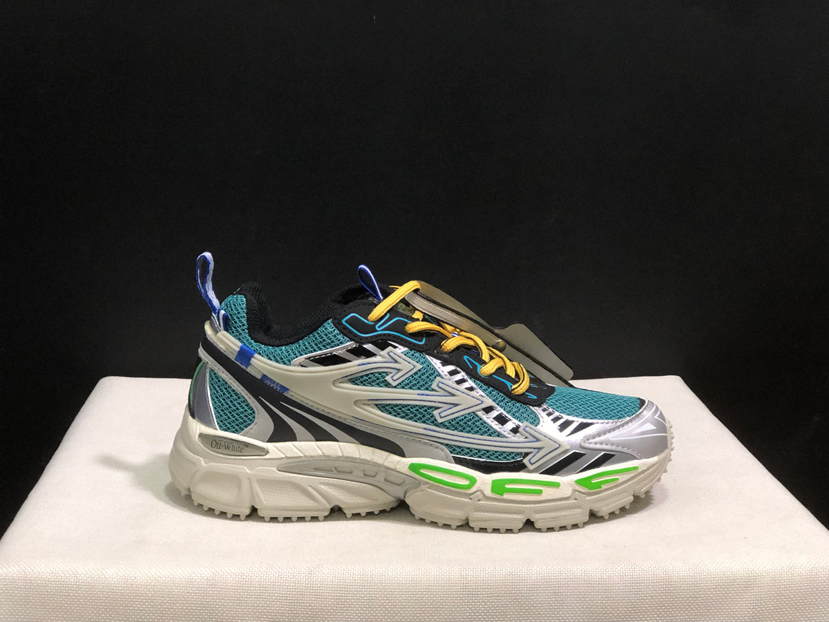 Side view of one sneaker showing the Off-White marking, teal mesh, contrasting overlays, and green sole details.