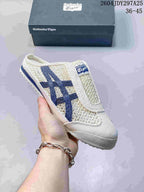Cream Onitsuka Tiger Mexico 66 Sabot slip-on sneaker with navy blue side stripes and a blue outsole accent.