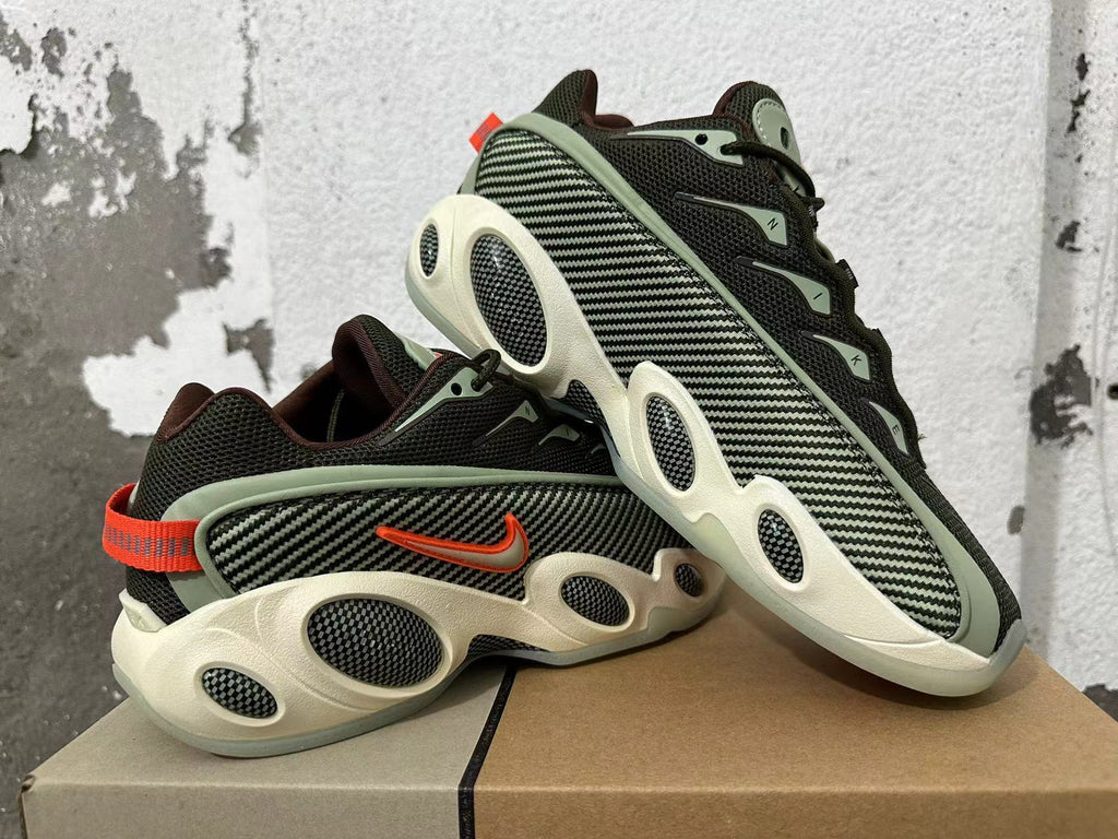 Pair of sneakers arranged together, showing patterned side panels and orange heel accents.