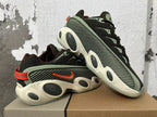Pair of sneakers arranged together, showing patterned side panels and orange heel accents.