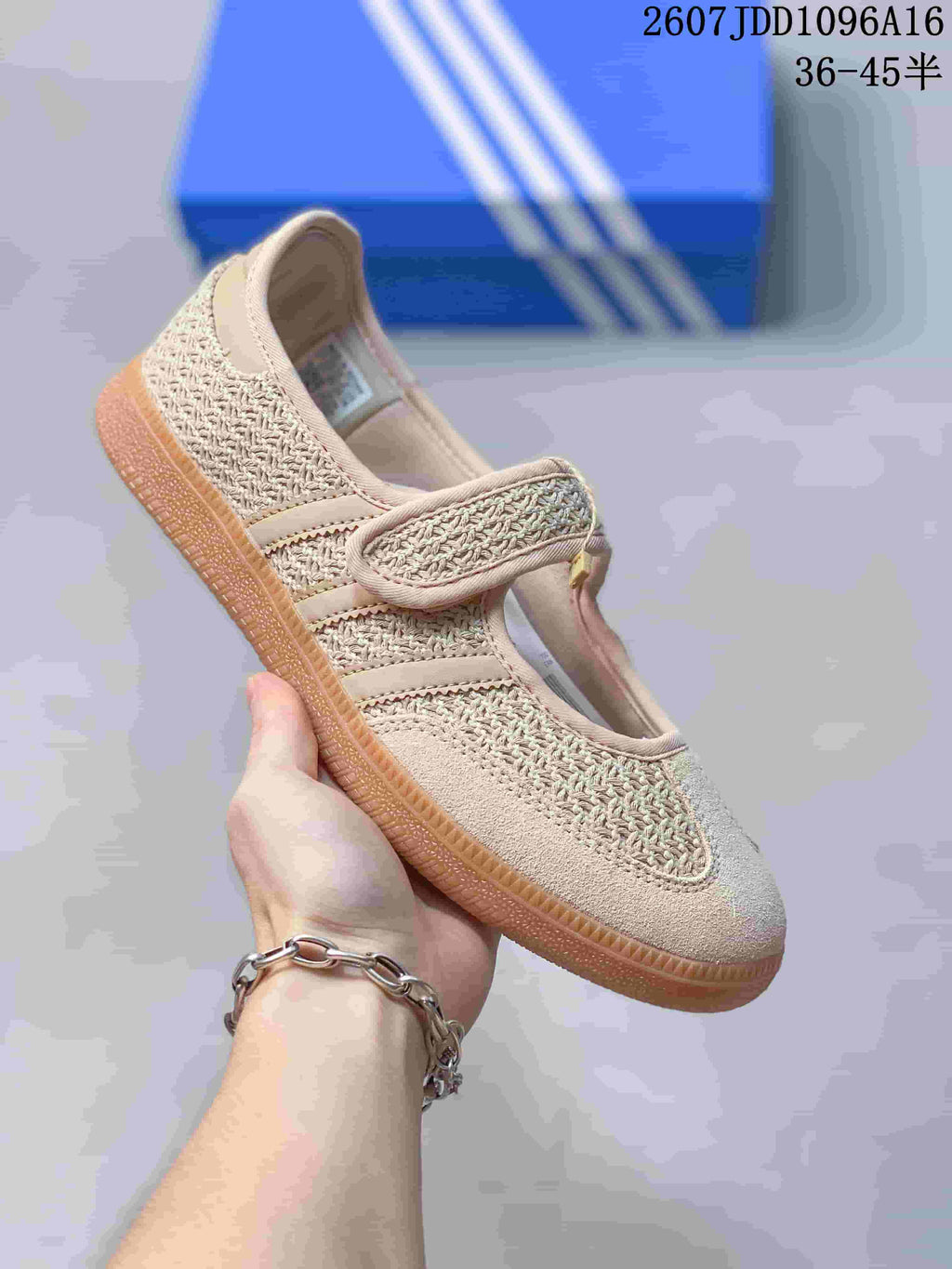 Side view of a beige Adidas Samba Jane W sneaker showing the textured upper, strap closure and gum-colored outsole.