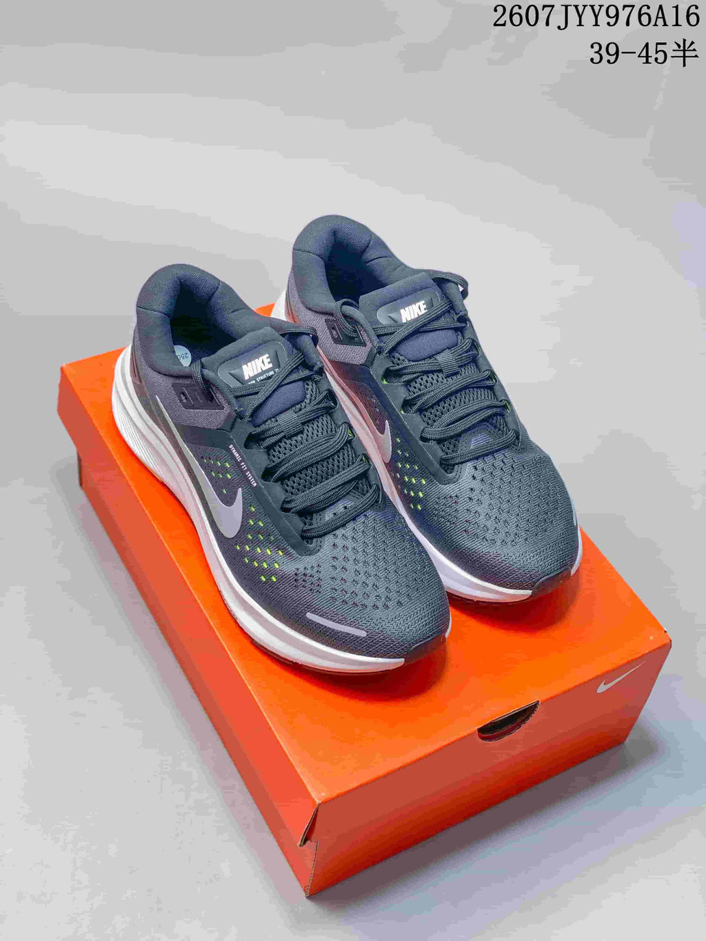 Pair of Nike Zoom Structure 23 sneakers photographed from above, showing the mesh forefoot and lace-up construction.