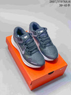 Pair of Nike Zoom Structure 23 sneakers photographed from above, showing the mesh forefoot and lace-up construction.